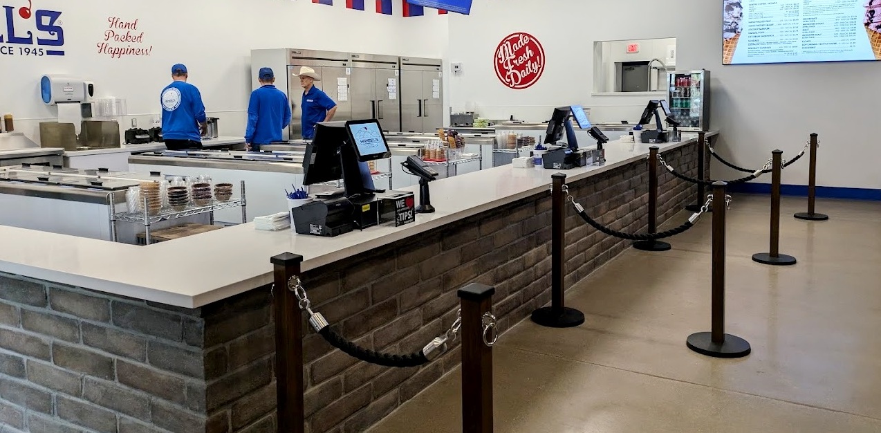 Queue lanes inside a high-use commercial environment.